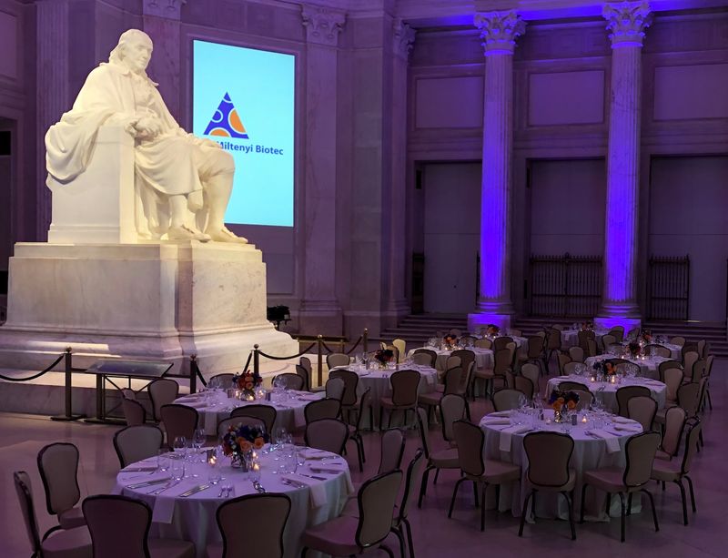 Seated dinner tables beside the Franklin statue